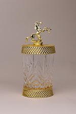 Equestrian Jewel luxury glass jar with gold detailing and golden horse sculpture lid by Atelier Carrousel