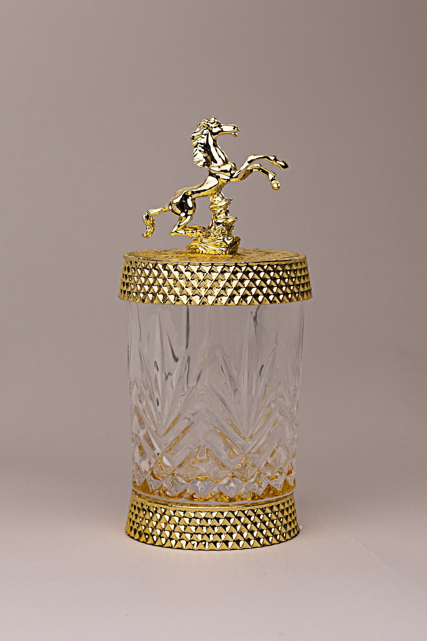 Equestrian Jewel – glass jar with gold detailing and golden horse sculpture lid فاخر من أتيليه كاروسيل