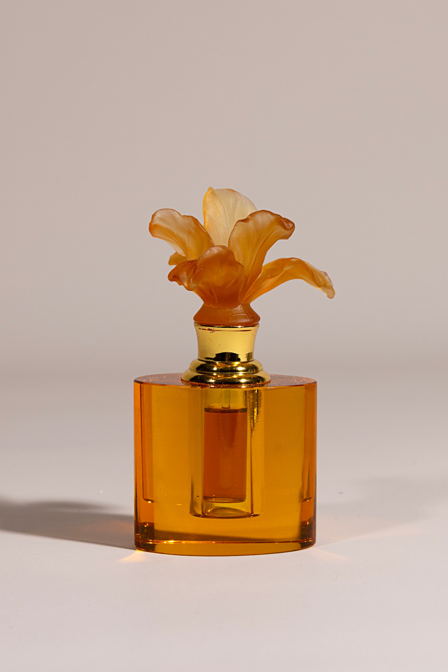Whisper Bloom luxury oval crystal oud bottle with delicate floral detail by Atelier Carrousel
