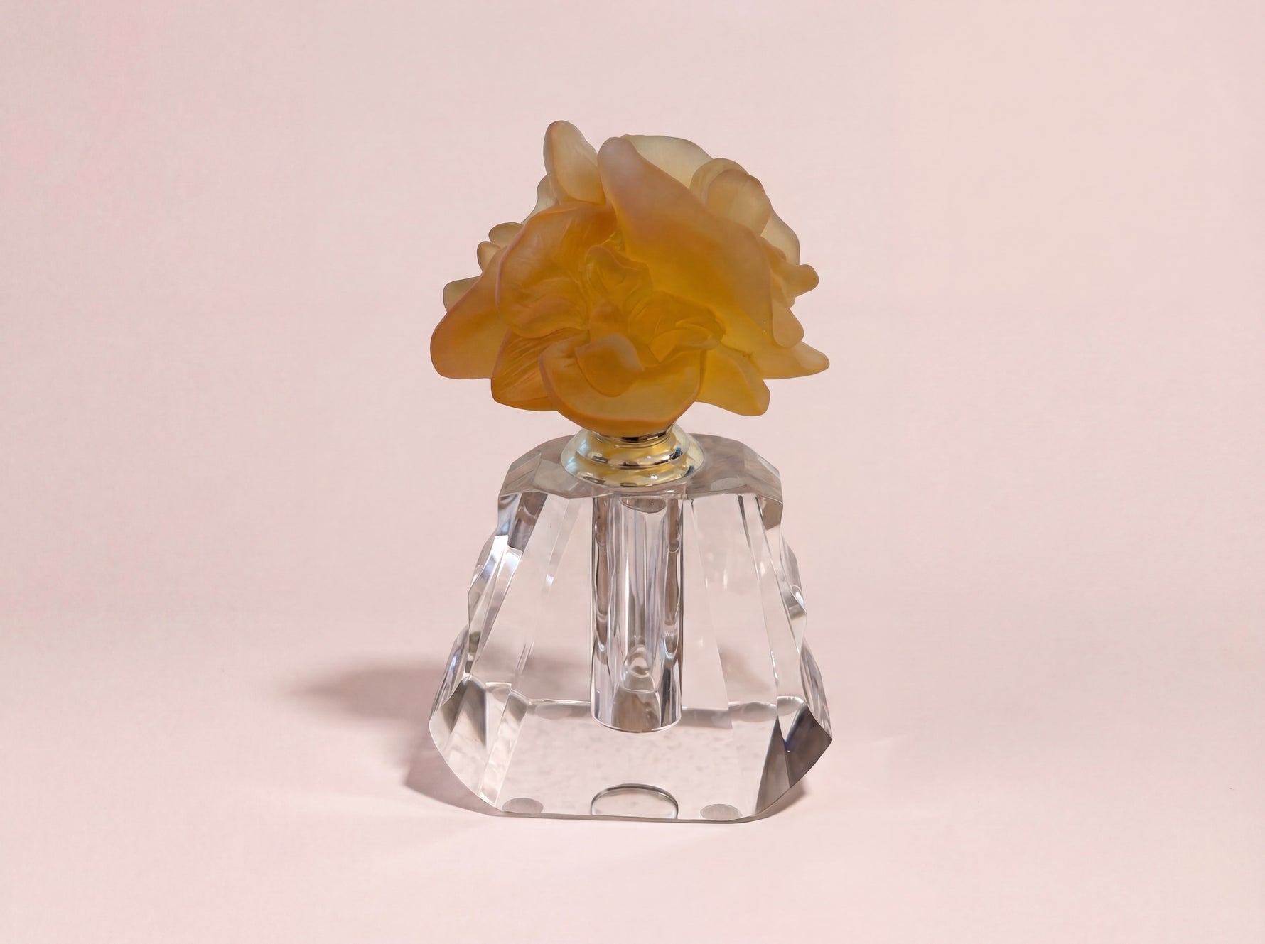 Orchidee luxury crystal oud bottle with amber orchid flower and faceted base by Atelier Carrousel